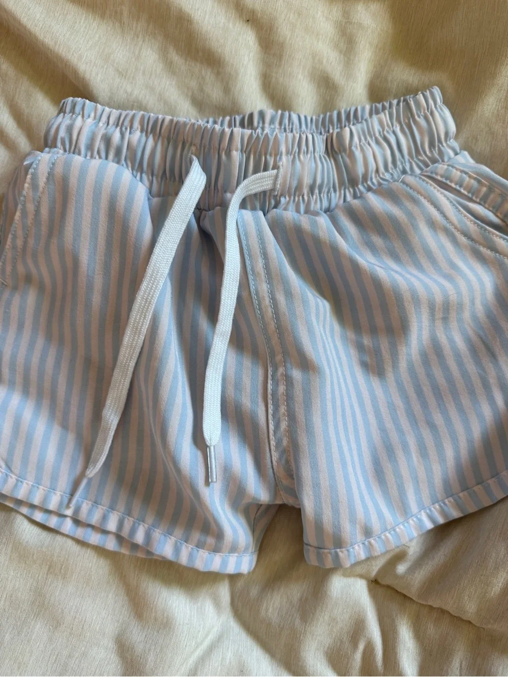 Kortni JeanStriped Blue and White boy’s swim trunks